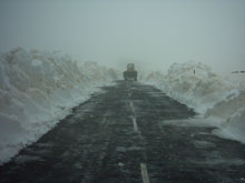 Clearing snow with power shovel